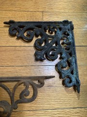 Lot Of 2 Rusty Victorian style Cast Iron Shelf L Brackets Fleur de lis Filigree